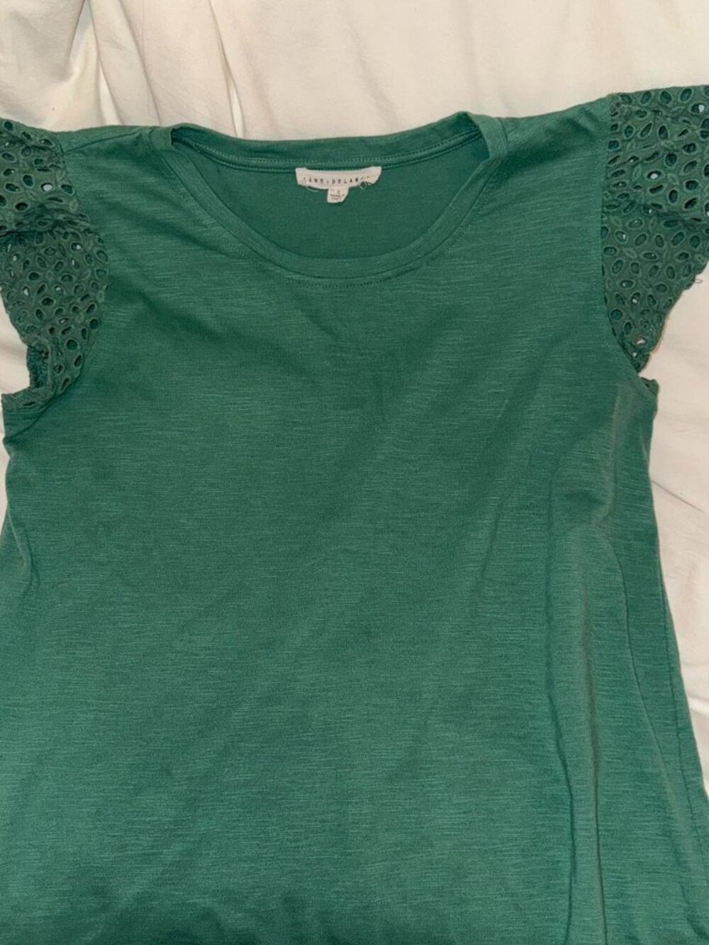 Green eyelet top with flutter sleeves